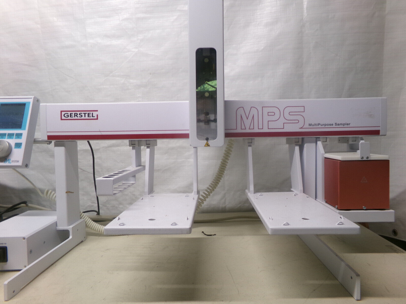 A white and red machine for chemical analysis.