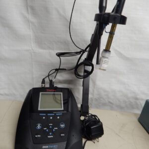 A benchtop pH meter with a probe and a power adapter.
